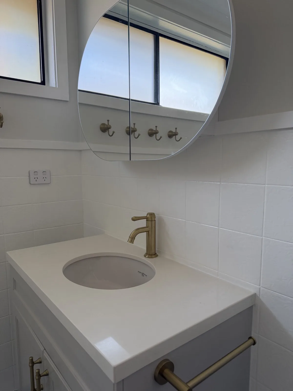 Bathroom vanity with painted walls and trim