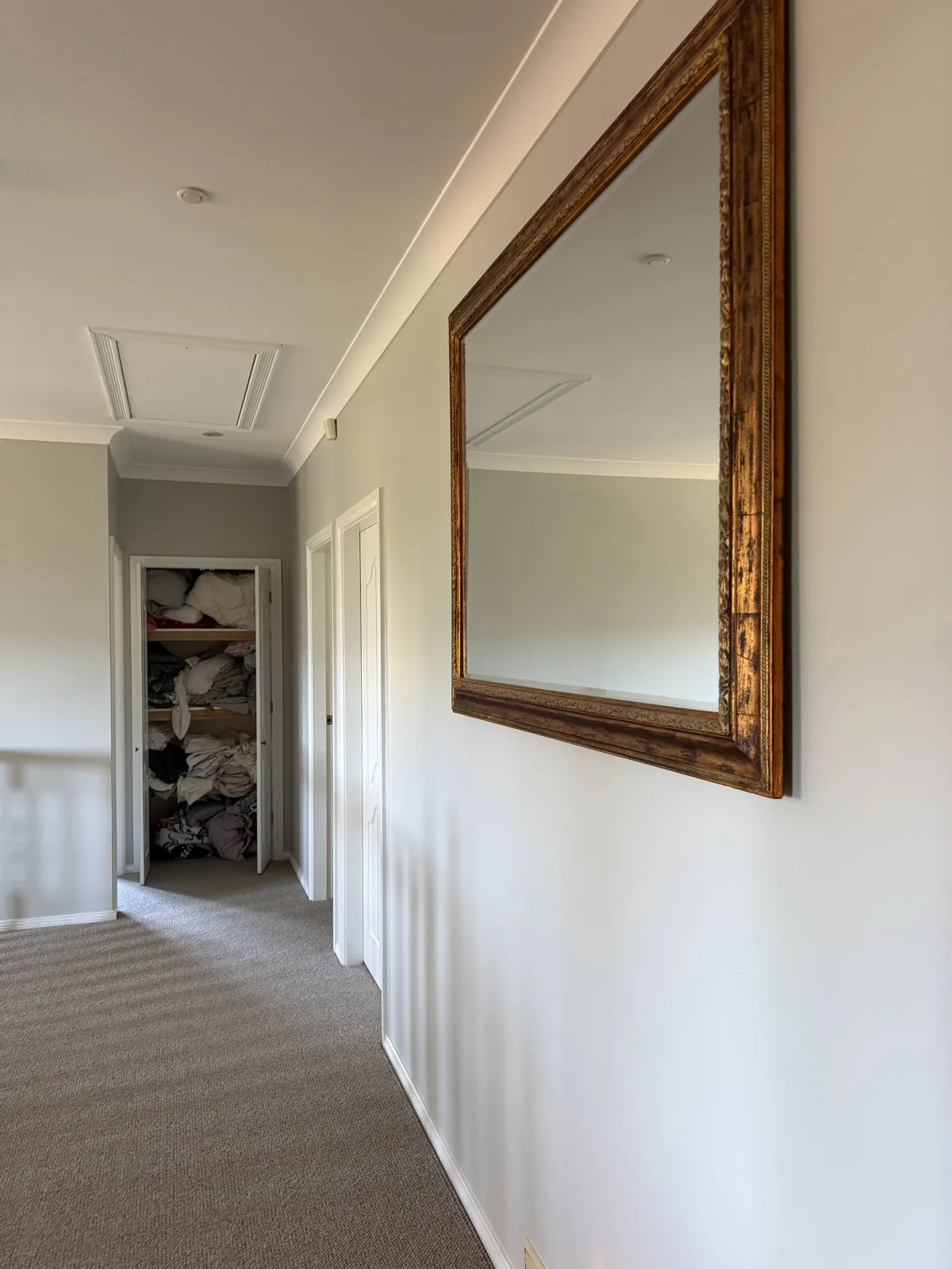 Hallway repainted in soft grey with white skirting and doors